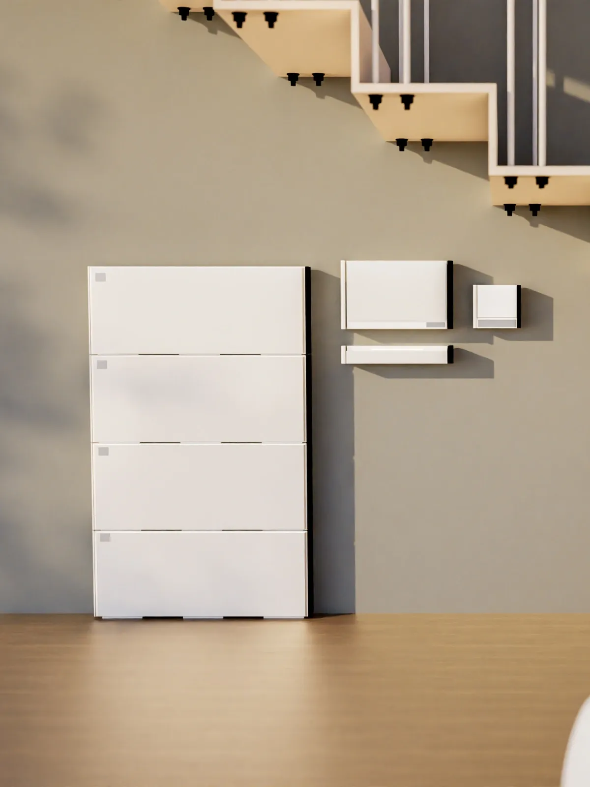 Computer-generated image of a four-module stacked home battery on a timber floor against a grey wall, with an inverter and two smaller wall-mounted units beside it.